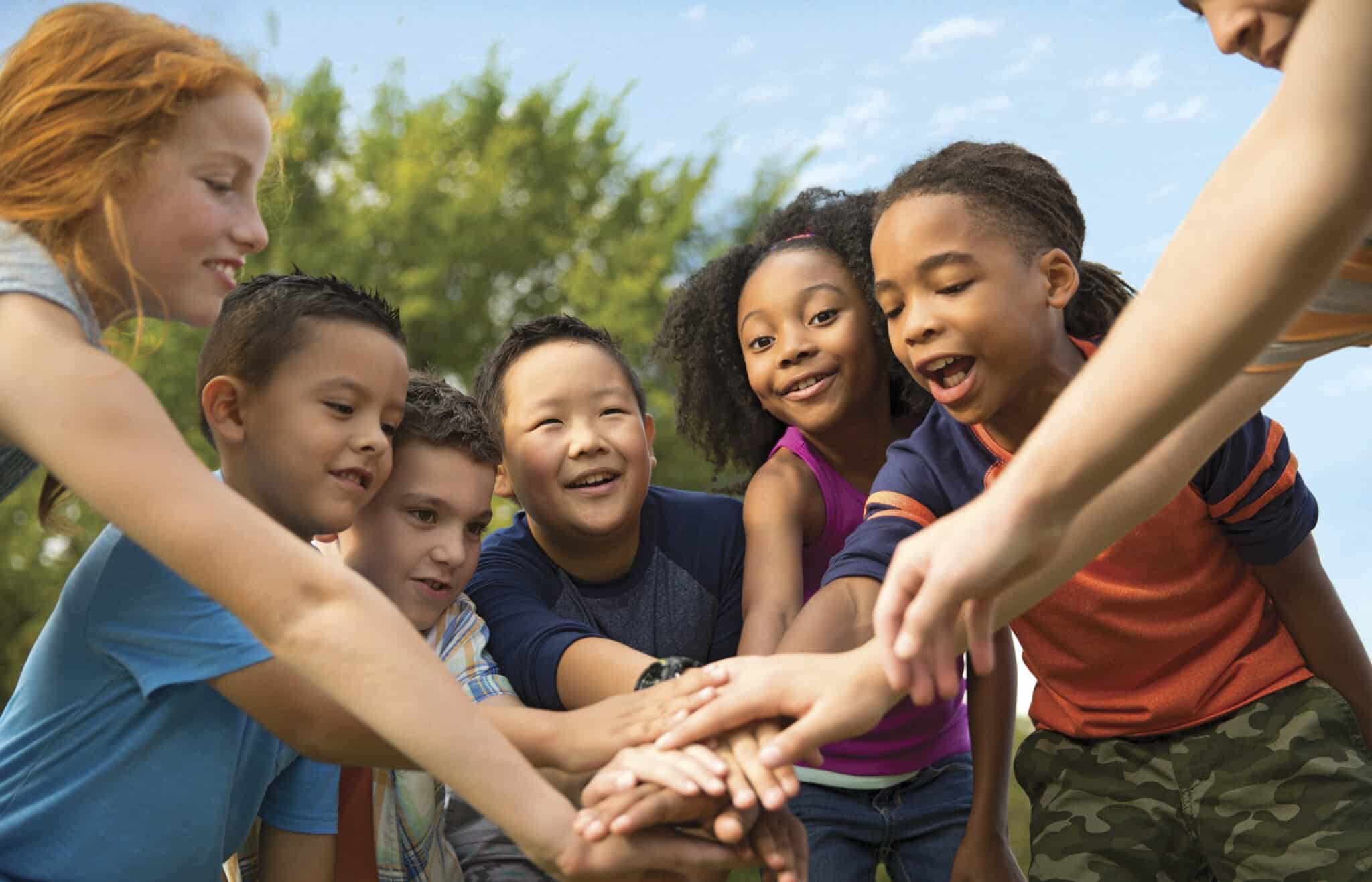Kids attending a YMCA Camp are seen learning values as a team.